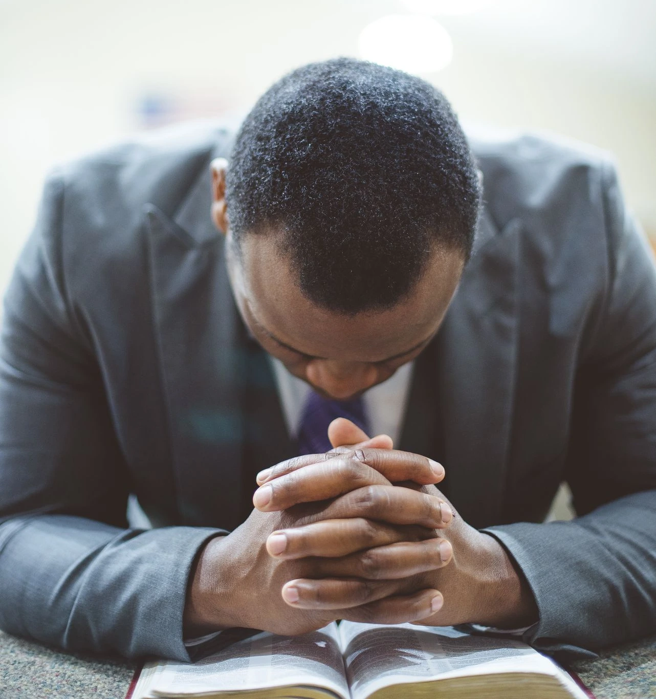 A man praying sincerely | Image Source: Freepik